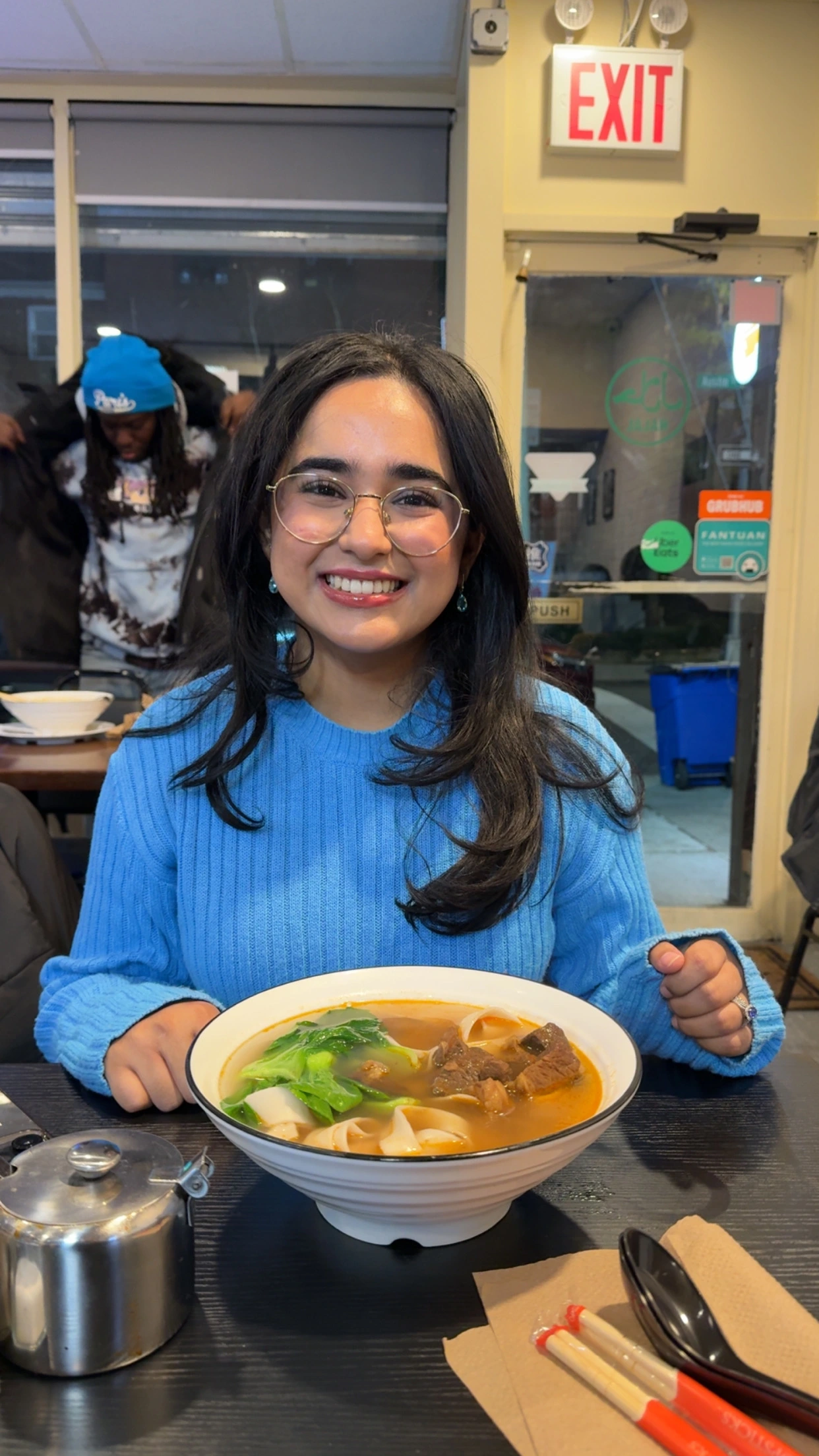 wife having braised beef noodle soup